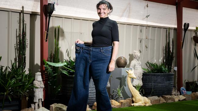 Rebecca Freer in a pair of old jeans that were once snug before her weight loss. The Advertiser/ Morgan Sette