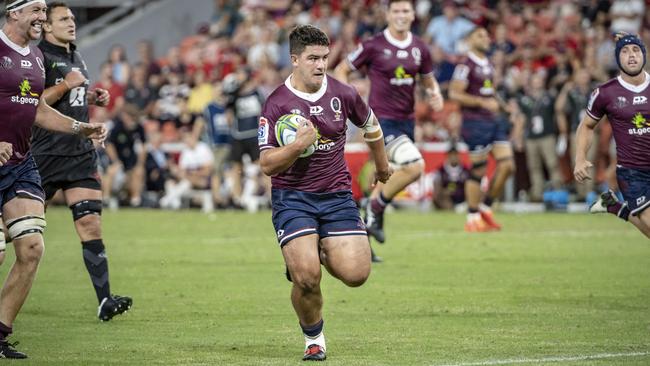 Queensland’s Josh Nasser runs the ball with grim determination. Picture: Brendan Hertel/QRU