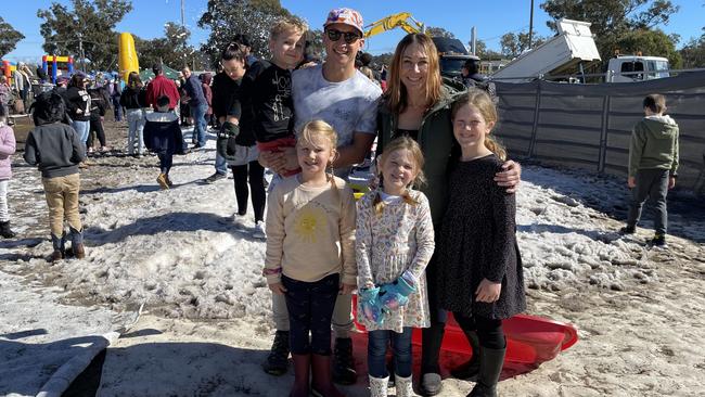 Spence (4) and Dave Chin with Milla (6), Myla (6), Tamara and Evie Russell (9) enjoy the snowfields at Snowflakes in Stanthorpe 2021. Photo: Madison Mifsud-Ure / Stanthorpe Border Post