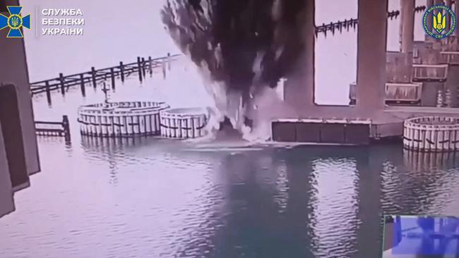 This video grab taken from a handout footage released by the Ukrainian Security Service on June 3, 2025, allegedly shows the explosion of the Kerch Bridge. (Photo by Handout / UKRAINIAN SECURITY SERVICE / AFP)