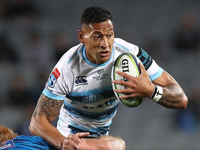 AUCKLAND, NEW ZEALAND - APRIL 06: Israel Folau of the Waratahs is tackled by Tom Robinson of the Blues during the round 8 Super Rugby match between the Blues and Waratahs at Eden Park on April 06, 2019 in Auckland, New Zealand. (Photo by Phil Walter/Getty Images)