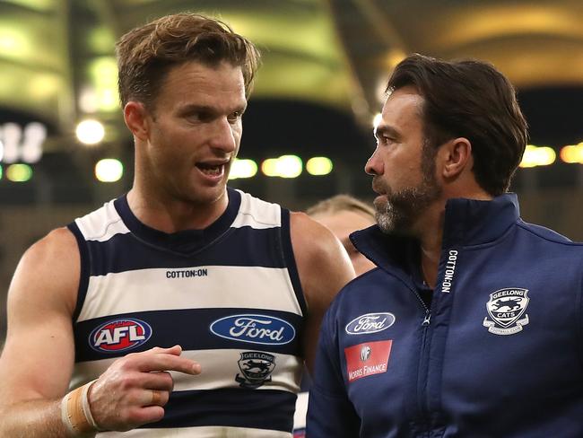 PERTH, AUSTRALIA - AUGUST 01: Lachie Henderson of the Cats talks with Chris Scott, head coach while walking from the field after being defeated during the round nine AFL match between West Coast Eagles and the Geelong Cats at Optus Stadium on August 01, 2020 in Perth, Australia. (Photo by Paul Kane/Getty Images)