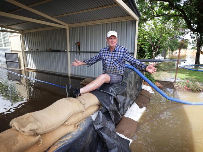 Merv Smith is fighting a losing game with the water inundating his Moama St property. Picture: David Caird