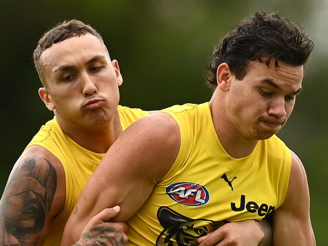 GOLD COAST, AUSTRALIA - OCTOBER 22: Daniel Rioli of the Tigers is tackled by Shai Bolton of the Tigers during a Richmond Tigers AFL training session at Metricon Stadium on October 22, 2020 in Gold Coast, Australia. (Photo by Quinn Rooney/Getty Images)