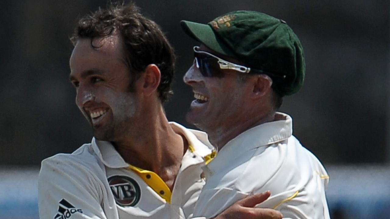 Australia cricketer Nathan Lyon (L) celebrates with his teammate Michael Hussey (R) during the second day against Sri Lanka at Galle on September 01, 2011. Photo: AFP