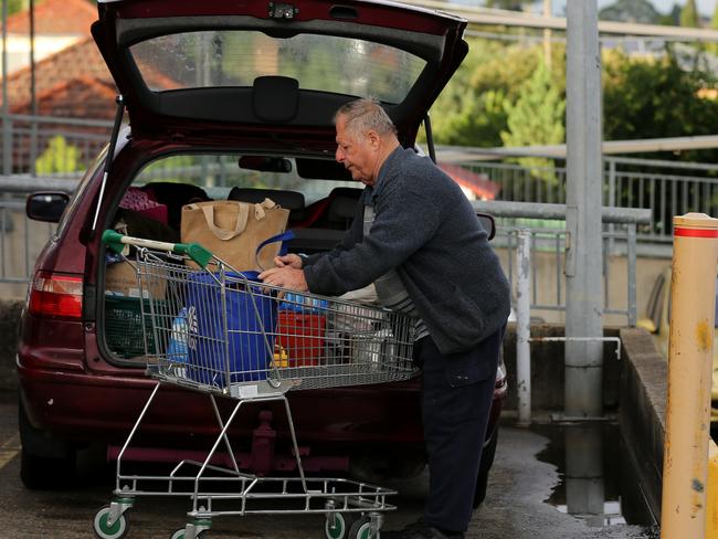 Shoppers are seen outside a Woolworths in Marrickville in Sydney, Tuesday, March 17, 2020. A dedicated shopping hour is underway for seniors and pension card holders who've been disadvantaged by panic buying by the general public in the wake of the coronavirus outbreak (AAP Image/Danny Casey) NO ARCHIVING