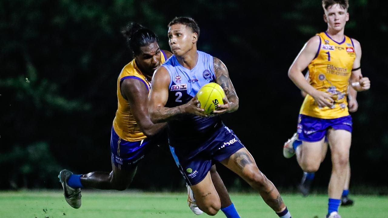 Nick Yarran of the Darwin Buffaloes escapes Wanderers' captain Mitchel Taylor in Round 16 of the 2023-24 NTFL season. Picture: Celina Whan / AFLNT Media