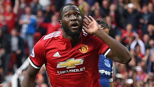 Manchester United's Belgian striker Romelu Lukaku (C) celebrates after scoring their third goal during the English Premier League football match between Manchester United and Everton at Old Trafford in Manchester, north west England, on September 17, 2017. / AFP PHOTO / Oli SCARFF / RESTRICTED TO EDITORIAL USE. No use with unauthorized audio, video, data, fixture lists, club/league logos or 'live' services. Online in-match use limited to 75 images, no video emulation. No use in betting, games or single club/league/player publications.  /