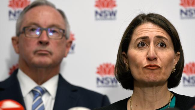 Left, NSW Minister for Health Brad Hazzard and Premier of NSW Gladys Berejiklian speak to the media about COVID-19 during a press conference in Sydney. Picture: Bianca De Marchi.