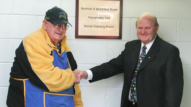 Mr Overton congratulates Norm Sivyer after having the home dressing-room named after him.