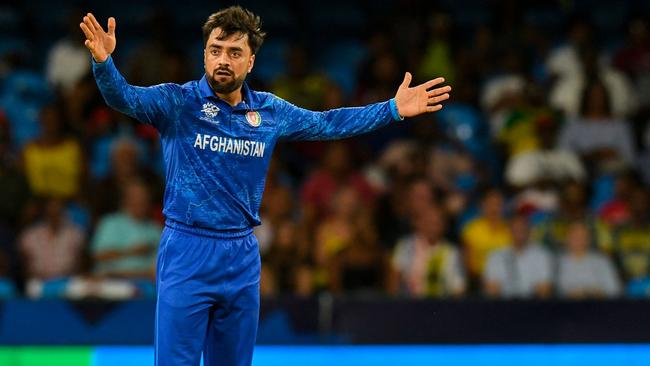 Afghanistan's captain Rashid Khan appeals for a wicket during the ICC men's Twenty20 World Cup 2024 Super Eight cricket match between Afghanistan and Australia at Arnos Vale Stadium in Arnos Vale, Saint Vincent and the Grenadines on June 22, 2024. (Photo by Randy Brooks / AFP)