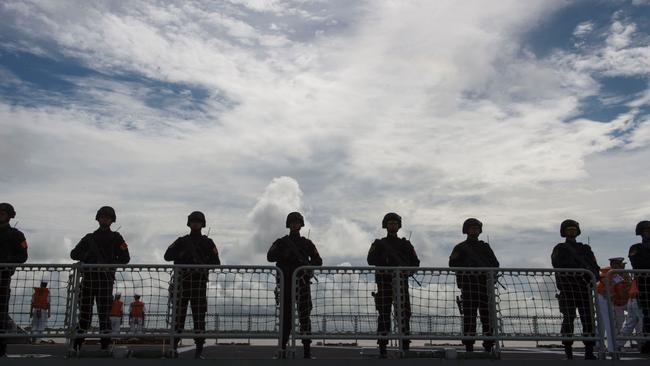 Chinese Navy personnel aboard the FFG Xiangtan belonging to the People's Liberation Army. Picture: AFP