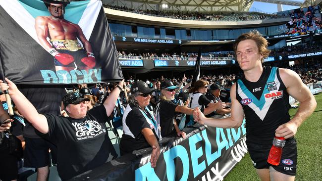 Port Adelaide Jared Polec shows his exhaustion after the Power’s tense victory. (AAP Image/David Mariuz) NO ARCHIVING, EDITORIAL USE ONLY