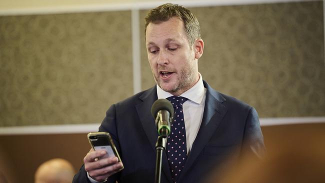 Ten journalist Peter van Onselen reads the alleged text exchange to the Prime Minister. Picture: Rohan Thomson/Getty Images