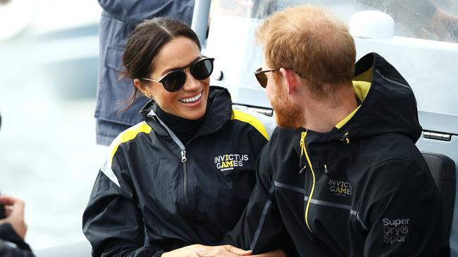 SYDNEY, AUSTRALIA - OCTOBER 21: Meghan, Duchess of Sussex and Prince Harry, Duke of Sussex watch on during the Elliott 7 Team racing during the Sailing on day two of the Invictus Games Sydney 2018 on Sydney Harbour on October 21, 2018 in Sydney, Australia. (Photo by Mark Kolbe/Getty Images for the Invictus Games Foundation)