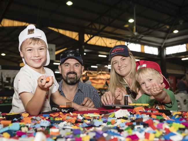 Louis (left) and Archie Humphrys build Lego with parents Curtis and Georgina Humphrys at the Brick Events Lego area at the Toowoomba Royal Show, Saturday, April 1, 2023. Picture: Kevin Farmer