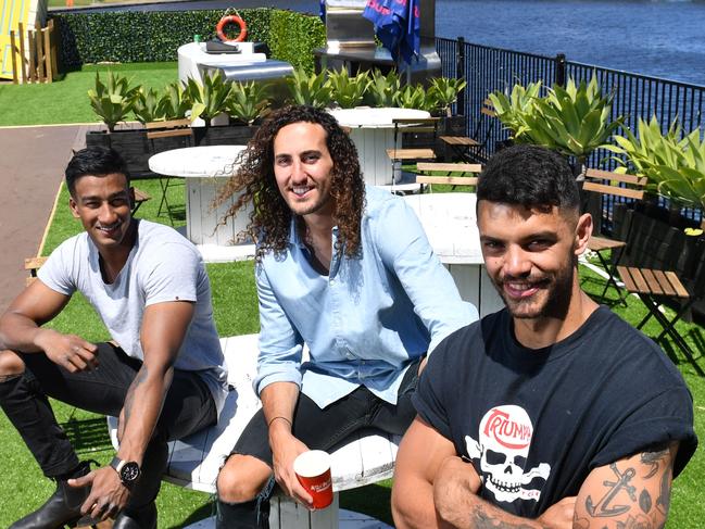 Danny Cooray, Dylan Auciello and Harrison Raphael pose for a photograph on the Pontoon on the River Torrens, Adelaide on Friday the 16th of November 2018. They will host "Archieâ€™s Clubhouseâ€™' for 6 weeks, which includes an interactive art exhibition, local Adelaide music, Stand-up comedy, Cult movies,  Local food outlets and Bar. (AAP/ Keryn Stevens)