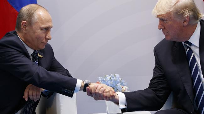 Was that a look of mutual appreciation back at the G20 in July? Or were they just comparing hand sizes? Picture: Evan Vucci