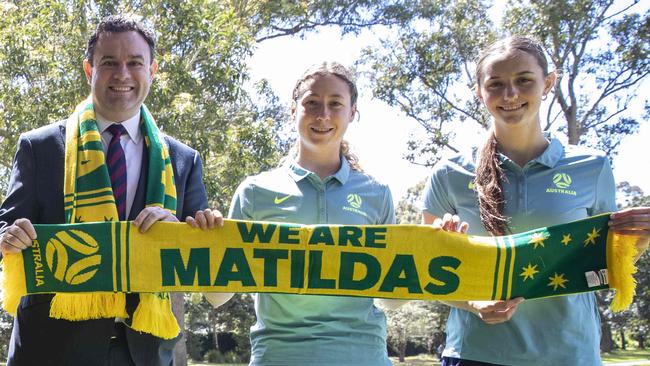 Stuart Ayres and Junior Matildas Sarah Hunter and Jessika Nash at a World Cup launch.