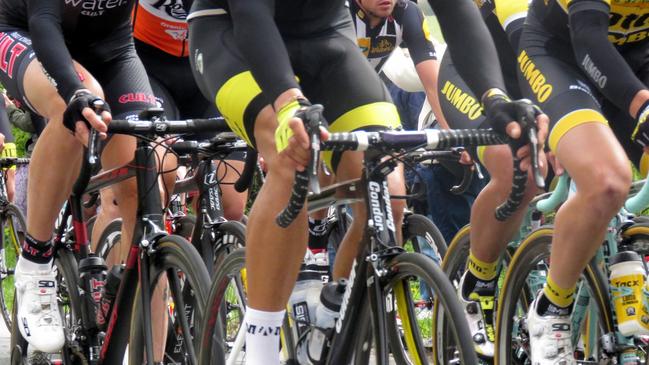 Wetwang, Bridlington, East Yorkshire England - April 18, 2015: Cyclists and support vehicles taking part in the Tour de Yorkshire cycle race entering the village of Wetwang. cycling, Lycra, generic