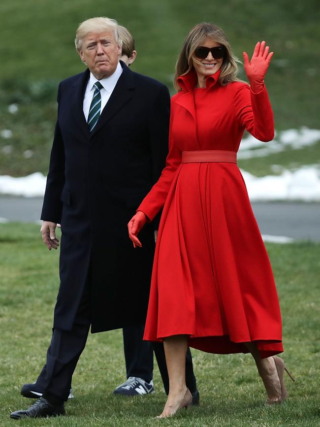 MARCH 17: There was no traditional St Patrick’s Day green for Melania as she and Donald left the White House for a break in Florida. New York designer Alice Roi created this elegant red coat, which the First Lady teamed with red gloves. Picture: Getty