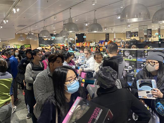 Shoppers worked in teams to grab a bargain. Picture: Vanessa Brown/news.com.au