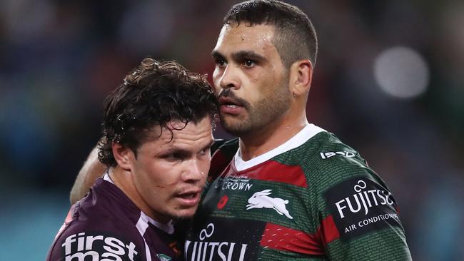 A dejected Greg Inglis gets a hug from James Roberts.