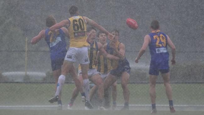 Sandringham and Williamstown played in torrential conditions. Picture: Dave Savell Photography