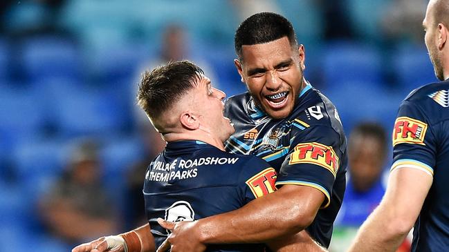 Gold Coast sporting success — Mitch Rein of the Titans celebrates with Moeaki Fotuaika of the Titans. The team is tipped to make the top eight of the NRL in 2021. (Photo by Matt Roberts/Getty Images)