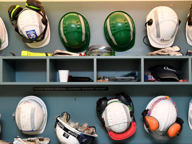 Workers helmets and safety equipment on display at the Qenos Altona plant in Melbourne, Monday, August 28, 2017. Earlier the Federal Opposition Leader Bill Shorten joined local Labor members, Joanne Ryan and Tim Watts on a tour at Qenos Altona Gas plant. (AAP Image/Joe Castro) NO ARCHIVING