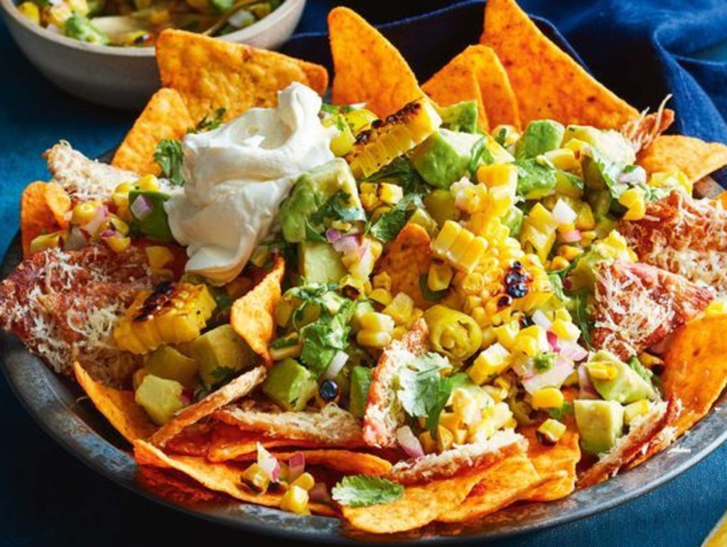 Crispy chicken skin nachos with jalapenÃÆo and avocado salsa.