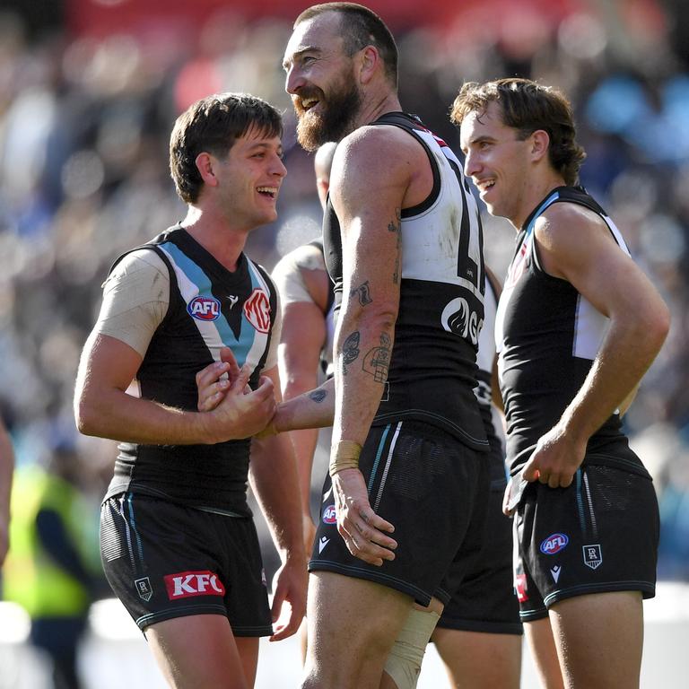 Zak Butters, Charlie Dixon and Francis Evans enjoy Port Adelaide’s win.