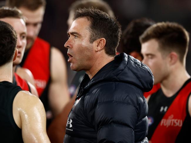 MELBOURNE, AUSTRALIA - AUGUST 10: Brad Scott, Senior Coach of the Bombers addresses his players during the 2024 AFL Round 22 match between the Essendon Bombers and the Gold Coast SUNS at Marvel Stadium on August 10, 2024 in Melbourne, Australia. (Photo by Michael Willson/AFL Photos via Getty Images)