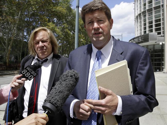 Gavriel Mairone, left, and Michael Elsner, attorneys for the plaintiffs in a case against Jordan-based Arab Bank, talks with reporters outside Federal Court, in the Brooklyn borough of New York, Thursday, Aug. 14, 2014. Families of about 140 American victims of two dozen terror attacks in Israel, Gaza and the West Bank during a Palestinian uprising from 2001 to 2004 went to court in an effort to force Jordan-based Arab Bank to pay for allegedly helping Hamas finance a 