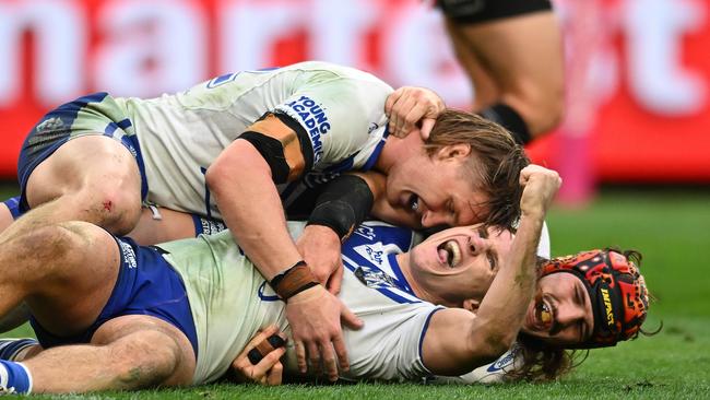 BRISBANE, AUSTRALIA - JULY 27: Connor Tracey of the Bulldogs celebrates with team mates after scoring a try during the round 21 NRL match between Brisbane Broncos and Canterbury Bulldogs at Suncorp Stadium, on July 27, 2024, in Brisbane, Australia. (Photo by Albert Perez/Getty Images)