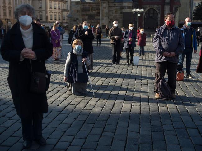 People take part in an outdoor Sunday mass at the Old Town Square in Prague. Picture: AFP