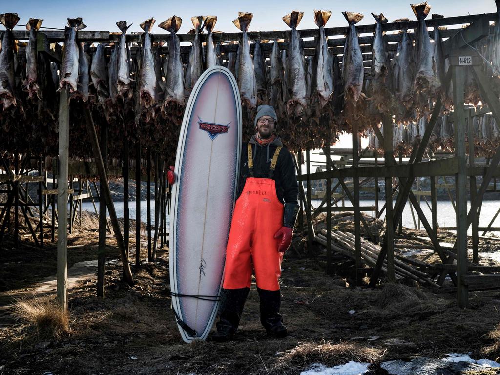 Nils Nilsen, 26, an employee in a fishing factory, poses on March 6, 2018, front of arctic cod in Henningsvaer, northern Norway, Lofoten islands, within Arctic Circle. Nils Nilsen, 26, an employee in a fishing factory “Surfing to me is peace of mind, quiet inside my head. One focus, that’s it. Of course it’s challenging yourself, I guess. Whatever the season, if I have the time, I’m in the water. I have been to Portugal a couple of times, up and down the coast.” Picture: AFP