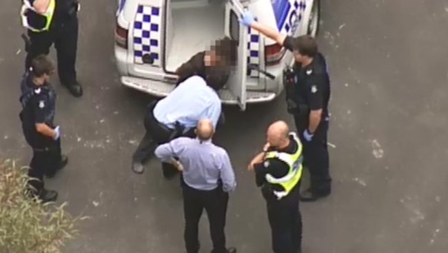 Police investigating the theft of a Porsche arrest a man. Picture: Channel 9.