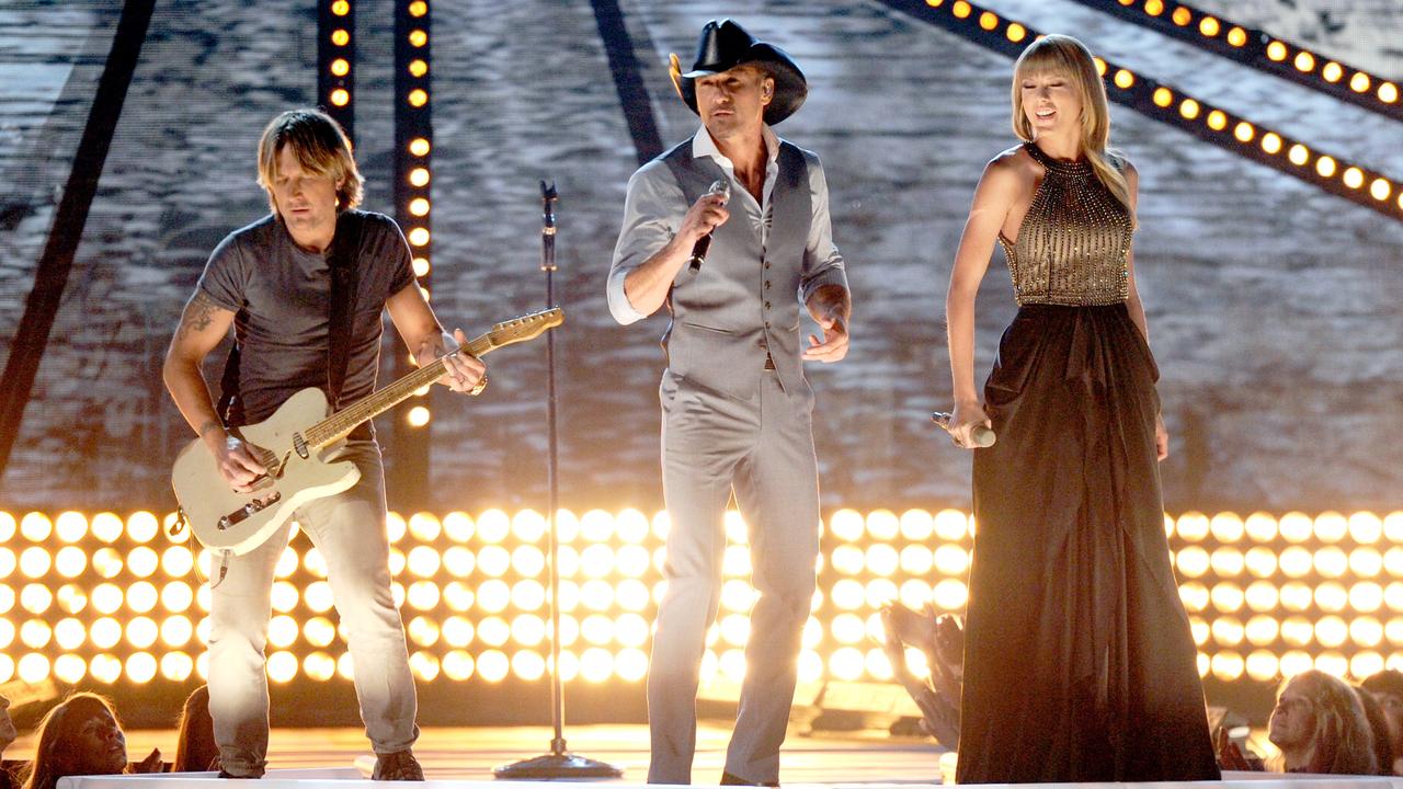 Australian Keith Urban and Taylor Swift with Tim McGraw during the Academy of Country Music Awards in 2013. Picture: Getty Images