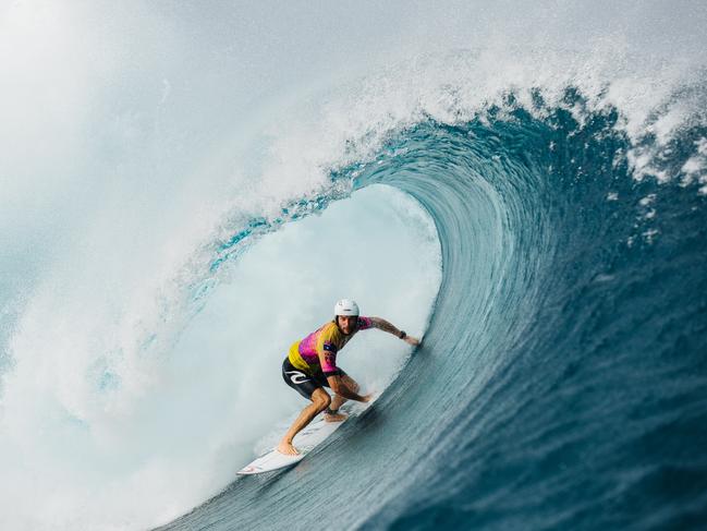 Wright, surfing a big wave in Tahiti in 2019, says the weight of the water landing on him was like ‘big explosions’. Picture: Matt Dunbar