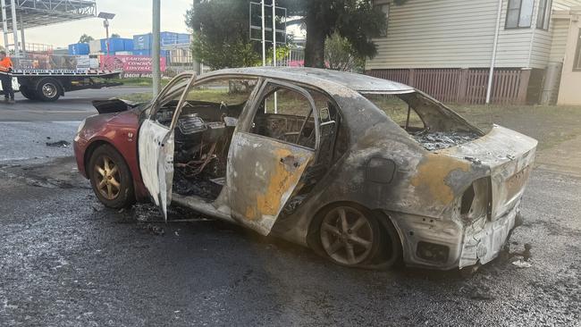 Stolen car torched and dumped in industrial precinct