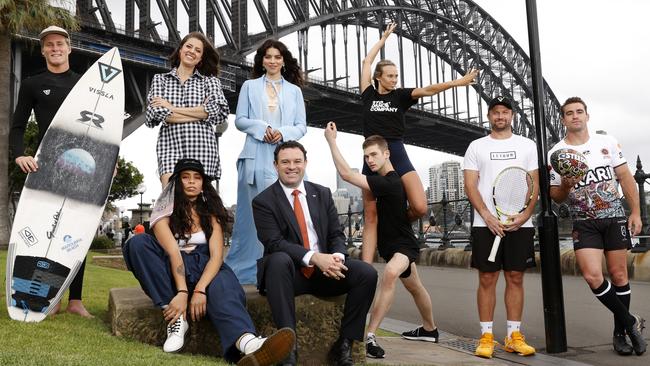 Minister for Tourism Stuart Ayres, with performers and athletes from events taking place in NSW over summer, including two dancers from the Sydney Dance Company. Picture: Jonathan Ng