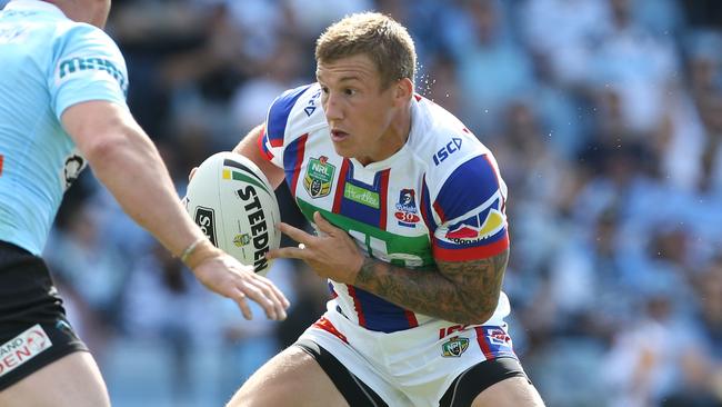 Trent Hodkinson of the Knights in action against the Cronulla Sharks.