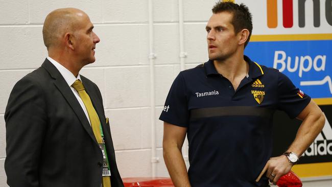 AFL Round 23. Hawthorn vs Carlton at the MCG. Hawthorn skipper Luke Hodge talks with CEO Stuart Fox after todays game. Pic: Michael Klein. Saturday September 5, 2015.