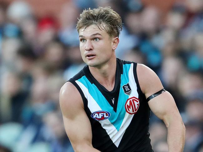 Anti-vaxxers attack AFL star after heart scare