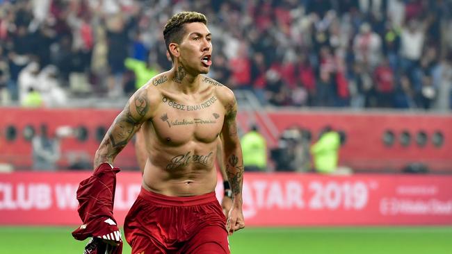 Liverpool’s Roberto Firmino celebrates after scoring the winning goal in the Club World Cup Final against Brazil's Flamengo in Doha