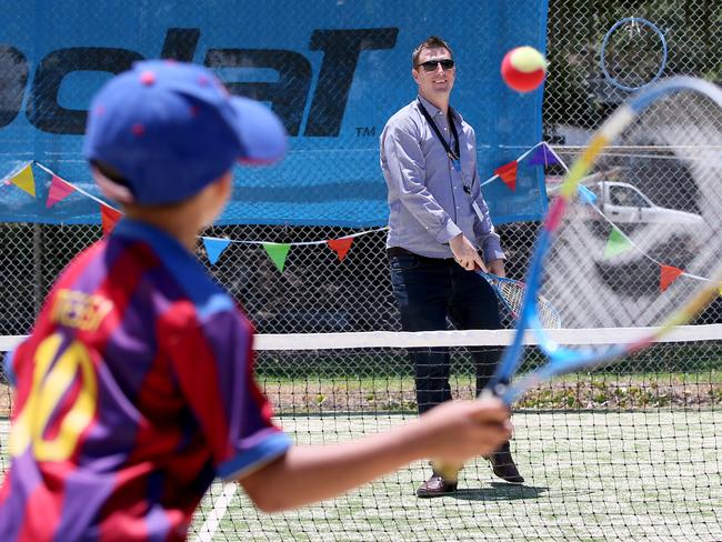 Noah Marolly, 7, has a hit against the then Warringah Mayor Michael Regan on the new Hot Shot courts at the Warringah Recreation Centre in December 2015. Picture: Troy Snook