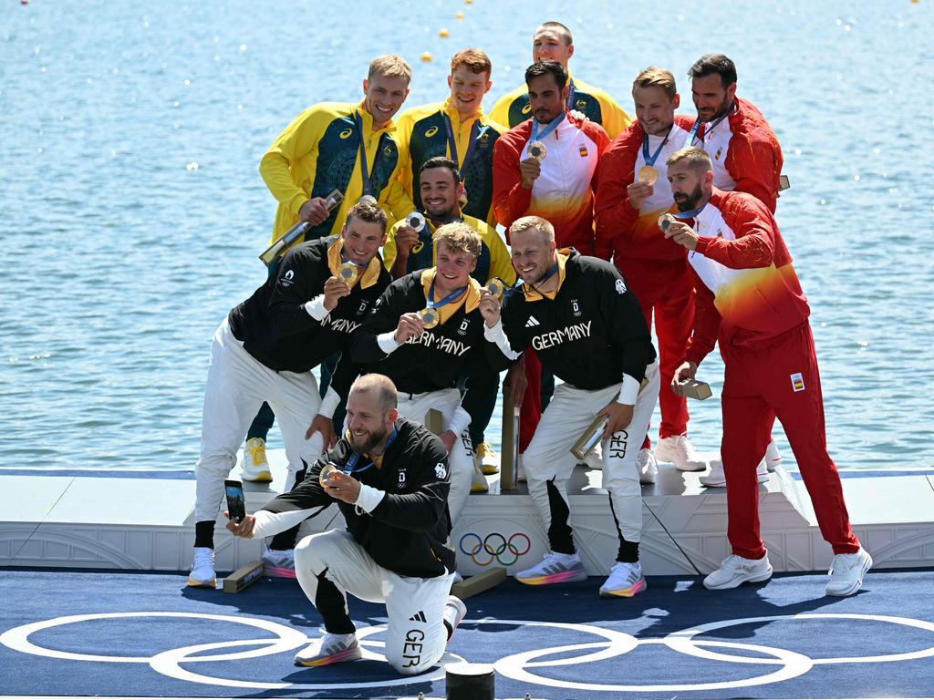 The medalists pose with their gold, silver and bronze. Picture: Bertrand Guay / AFP