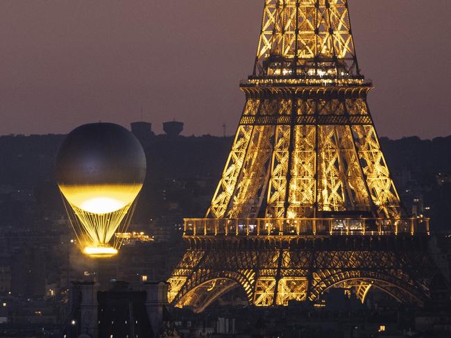 PARIS, FRANCE - AUGUST 10:  Olympic cauldron as it rises high near Eiffel tower on day fifteen of the Olympic Games Paris 2024 at  on August 10, 2024 in Paris, France. (Photo by Maja Hitij/Getty Images)