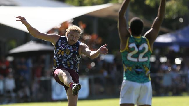 Jackson Calder of the Cairns City Lions kicks a goal. Picture: Harry Murtough